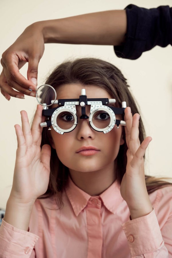 Woman getting an eye exam at Eyemart in Iowa