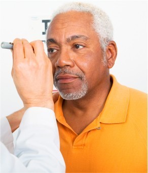 Man getting an exam for bifocal or multifocal contact lenses