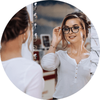 Woman trying on eyeglasses at Eyemart Optical