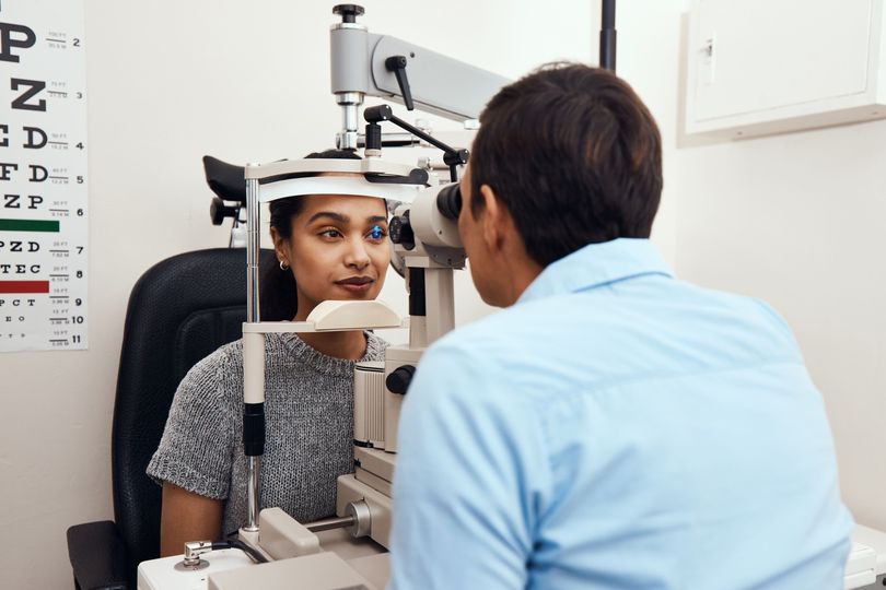 Young woman getting an eye exam.